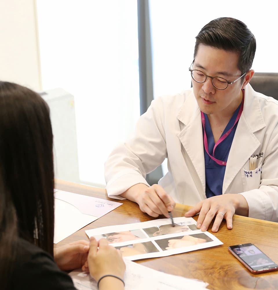 Dr. Rhee explaining to patient optimized